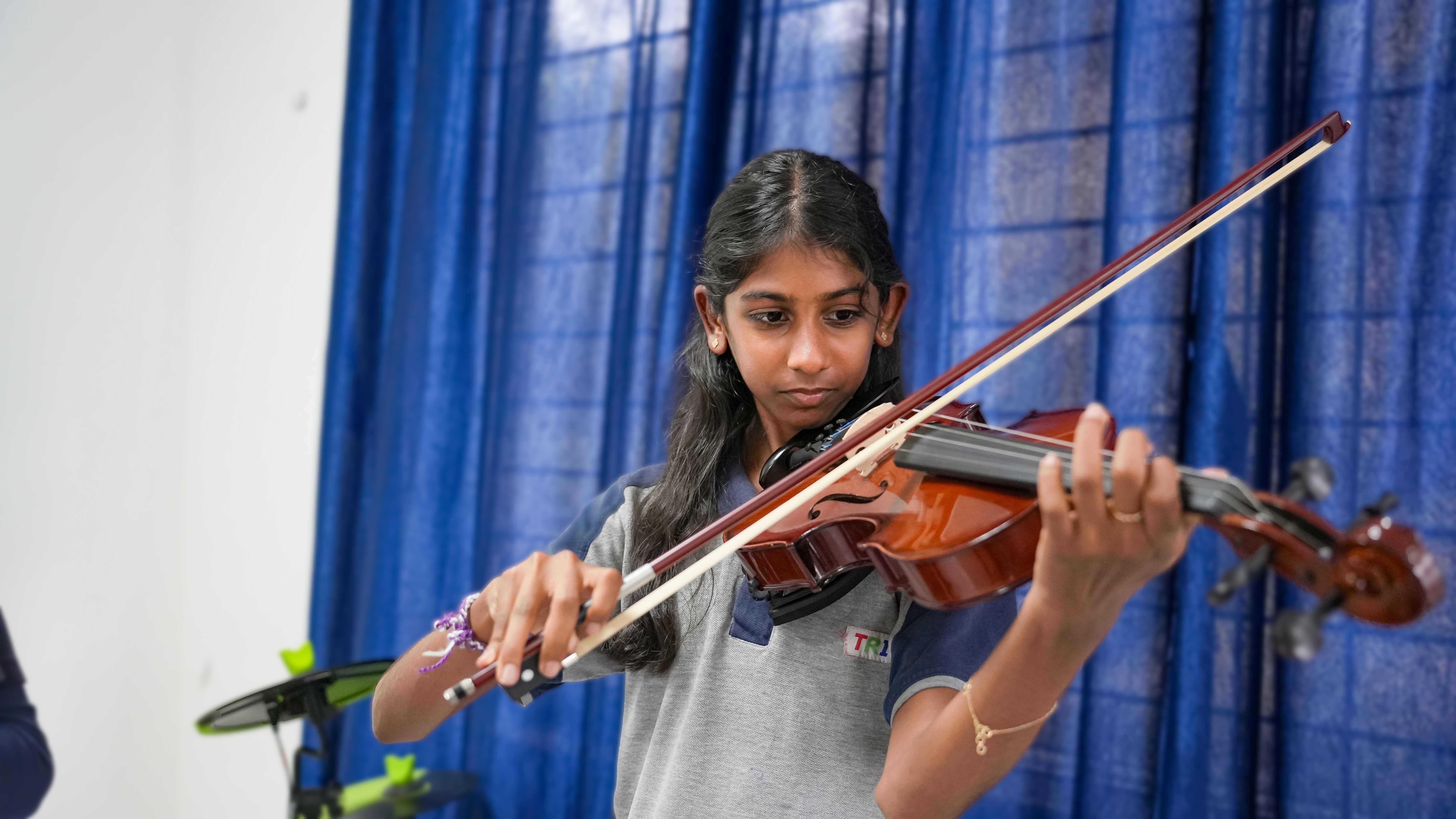 Children painting and drawing in an art class